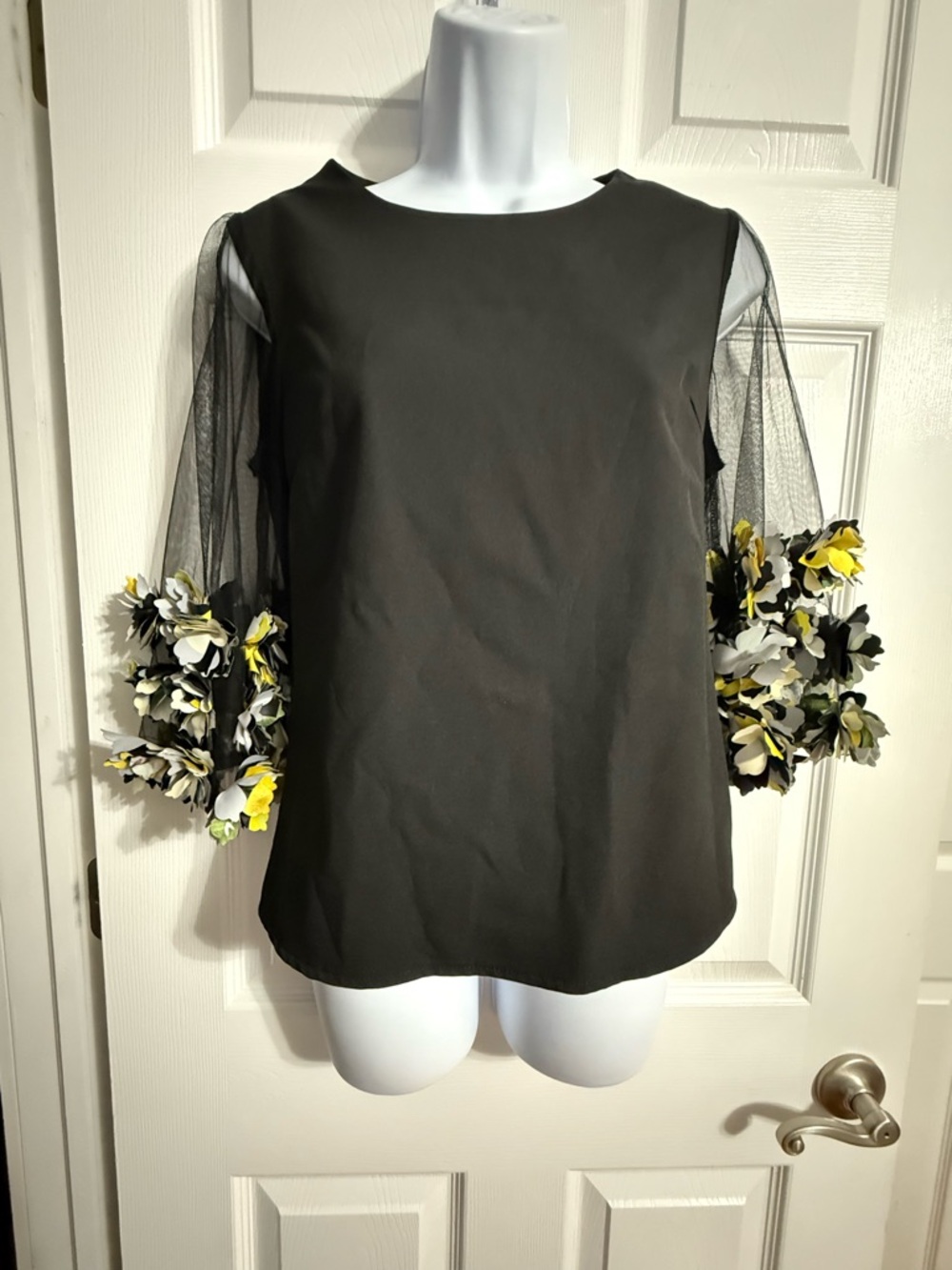 Gracia Black Top with Sheer Mesh Sleeves and Yellow-White Floral Appliqués